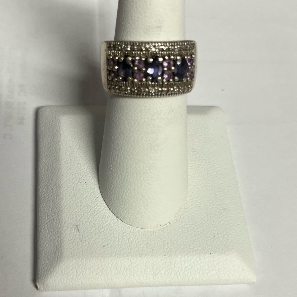 This is a beautiful silver tanzanite band with three tanzanite stones.